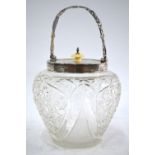 An Edwardian cut glass biscuit barrel with silver collar, cover and swing handle, Walker & Hall,
