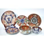 Four Circular Japanese Imari or polychrome dishes, together with two bowls.