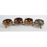 A set of four Victorian silver circular open salts with embossed and chased decoration,