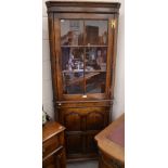 A good quality oak corner cabinet with glazed upper door (probably Brights of Nettlebed)
