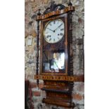 A 19th century American pole clock in parquetry-inlaid case with mirrored back,