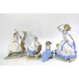 Four Nao figurines - all seated 14.