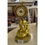 A French gilt metal mantel clock with paste-set bezel,