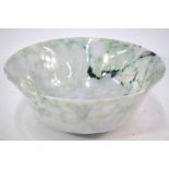 A large jadeite or mottled green stone b