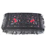 A Chinese silk black ground shawl, decor