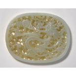 An oval, green jade plaque of oval and r