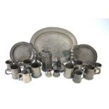 A quantity of antique pewter, including plates and platters, candlesticks, tankards, etc.