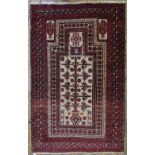 An old Belouch prayer rug, red ground, 160 x 100 cm to/w an old Turkoman rug,