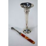 A late Victorian paper-knife with agate blade, the silver handle with snarling tiger's head finial,
