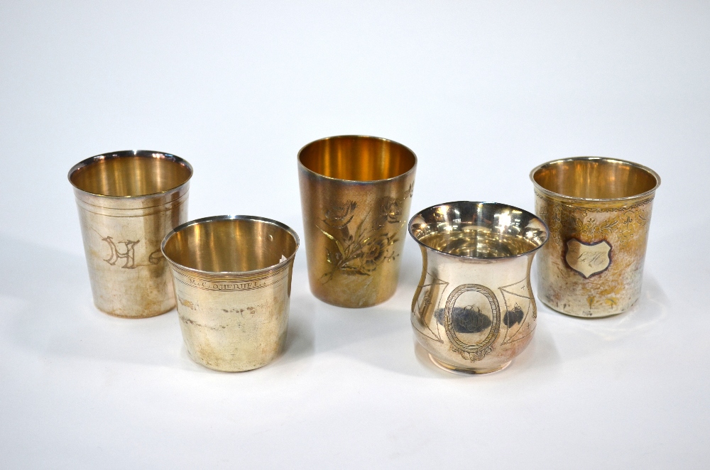 A German gilt beaker with floral engraved decoration, .