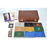 Nine New Zealand annual coin sets, to/w various crowns and other coins,