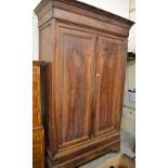 A very large 19th century French provincial walnut armoire of chateau proportion with moulded