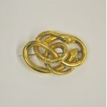 A Victorian yellow gold coiled serpent brooch with metal pin,