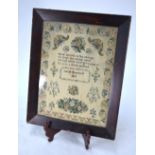 A Victorian finely-worked petit point sampler with floral and foliate motifs and border and