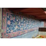 A Persian William Morris style floral design runner, blue ground,