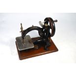 Willcox & Gibb hand sewing machine on hardwood base mount,