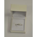 A single stone brilliant cut diamond ring in 18ct white gold four claw setting, approx 0.