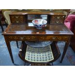 A Sheraton Revival satinwood inlaid rosewood writing table with inset leather top over a pair of