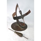A copper and brass sundial by Silas Higgon, 30 cm high,