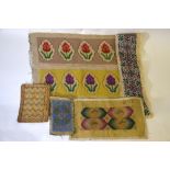 A collection of over twenty wool-worked tapestry panels including a finely worked petit-point pouch