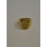 A yellow metal Oxford style signet ring stamped 14, approx 8.