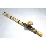 A Vietnamese ivory opium pipe with finely-chased and embossed white metal mounts,