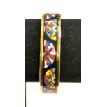 Patricia Rox - A polychrome enamel bangle featuring fan shaped motifs on black background, approx 1.