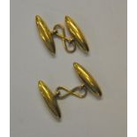 A pair of yellow metal torpedo style cufflinks with chain between, stamped 15ct, approx 3.