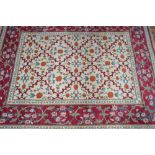 A Turkish Lal carpet, the camel ground with linked vine design,
