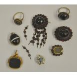 A collection of Victorian garnet set jewellery including a fringe target brooch with cabochon