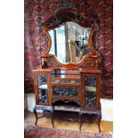 A late 19th century walnut mirror-backed chiffonier display cabinet,