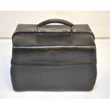 A vintage black morocco leather Gladstone bag with green moire silk lining