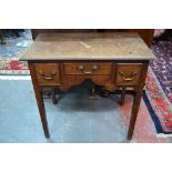 An 18th century oak lowboy,