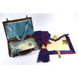 A leather case containing Masonic aprons,