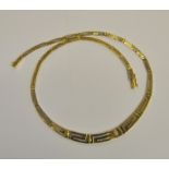 A yellow metal graduated Greek key style necklace stamped 585, approx 19.