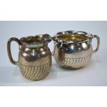 A US Sterling cream and sugar pair with spiral fluting,