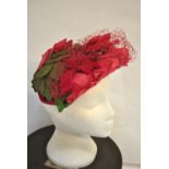 A 1950s pink rose and leaf decorated hat retailed by Fenwick Ltd., Newcastle-Upon-Tyne and Bond St.