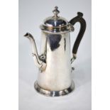 An Edwardian silver cafe au lait pair in the Georgian manner, of plain tapering form,