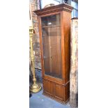 An Army & Navy style late 19th century oak part glazed gun cabinet,