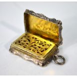 A Victorian foliate-engraved silver fob vinaigrette, the gilt interior with pierced grille,