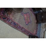 A Persian Hamadan long rug, the camel ground centred by a geometric rose medallion,