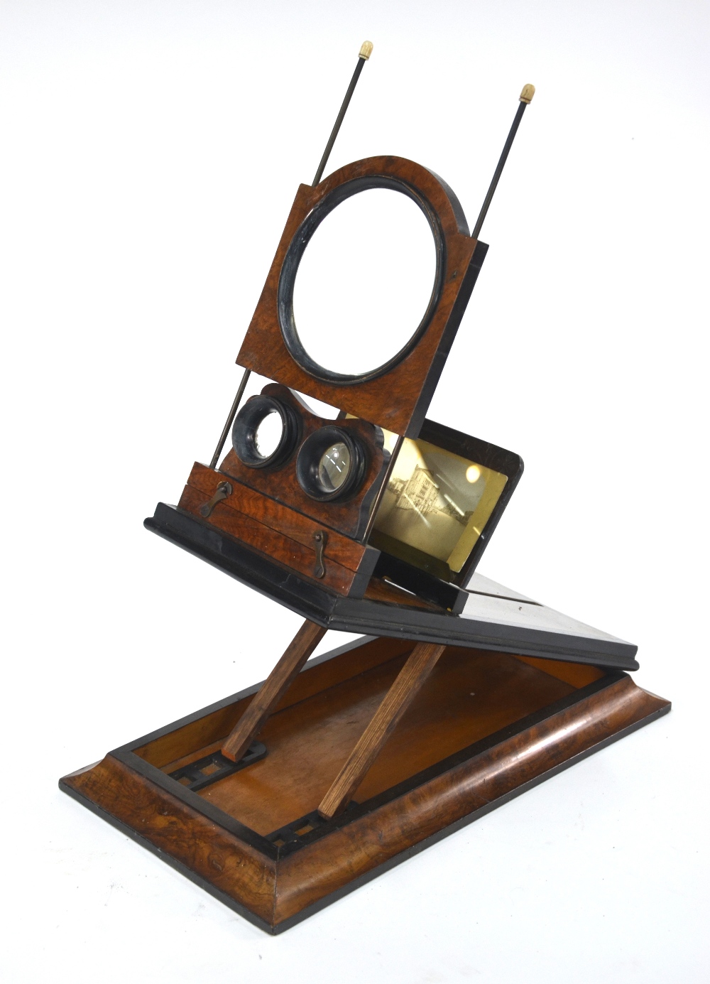 A Victorian stereo graphoscope of typical rectangular and folding form with central magnifying