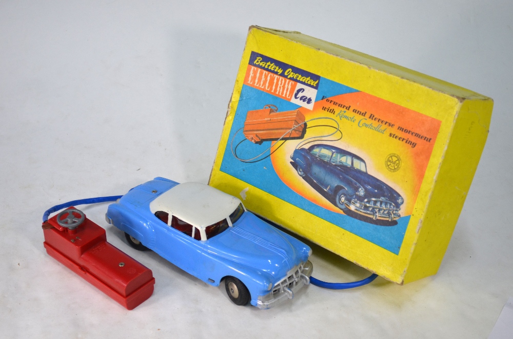 A boxed Marx Toys Battery Operated Electric Car - 'Forward and Reverse Movement with Remote