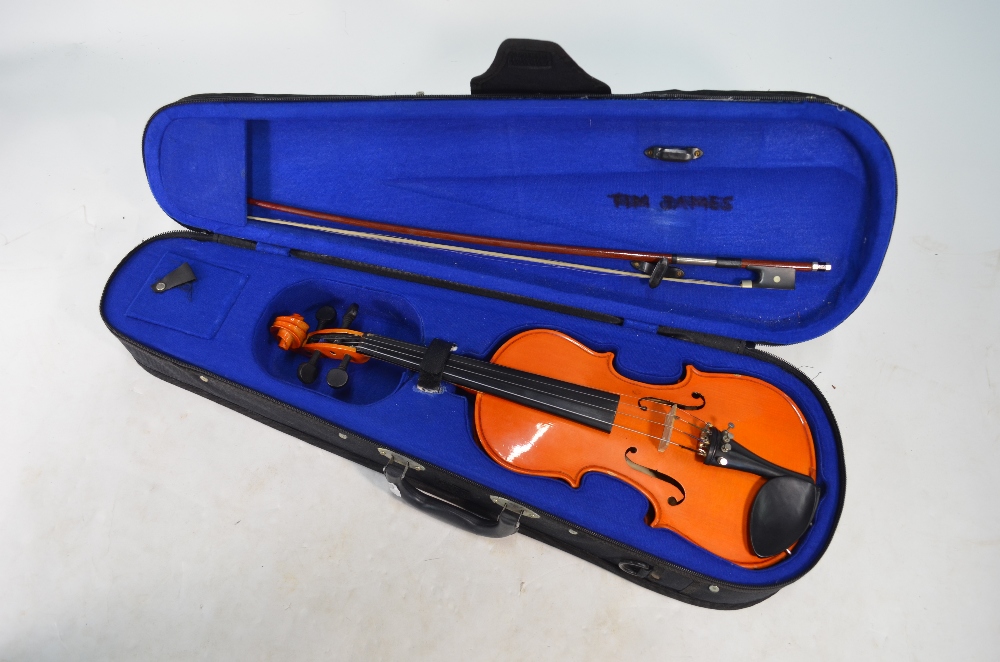 A child's cased Yamaha violin with 31 cm two-piece flame back,