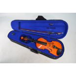 A child's cased Yamaha violin with 31 cm two-piece flame back,