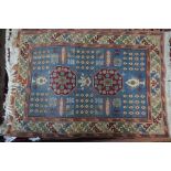 A Turkish Konya small rug, pale blue and camel ground,