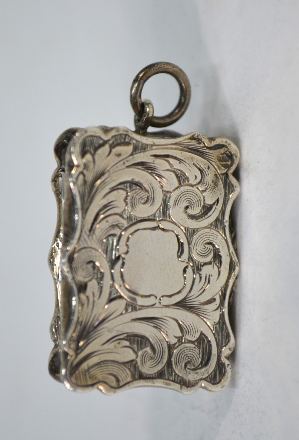 A Victorian foliate-engraved silver fob vinaigrette, the gilt interior with pierced grille, - Image 2 of 4