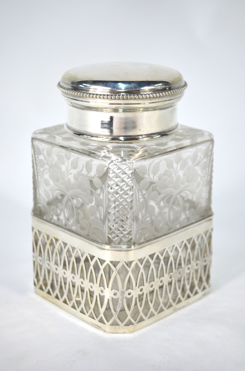 A German square-cut glass tea caddy and stopper with strawberry-cut canted corners and wheel-etched