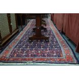 An old Persian Malayer runner, predominantly blue ground with repeating design,
