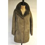 A mushroom coloured lady's sheepskin jacket with darker lining and collar, size 14,
